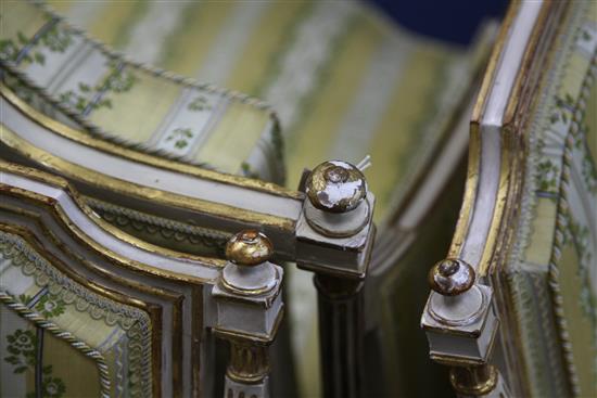 A suite of George III white and gilt seat furniture, comprising five armchairs and a settee, W.6ft 6in.